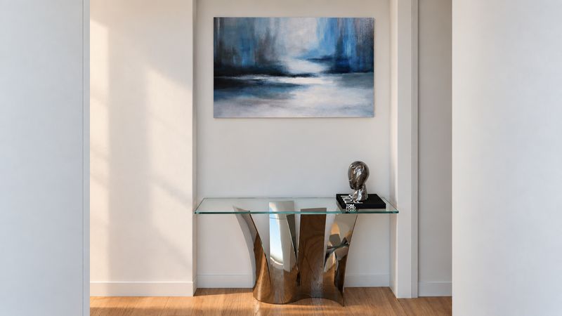 Entry console with a sculptural base and an abstract painting, design visualization