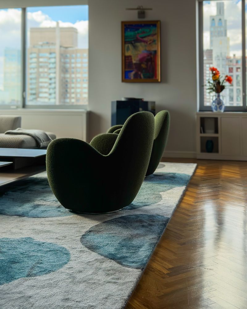 Green bouclé swivel chairs on a blue and ivory rug, Upper&nbsp;East&nbsp;Side Condominium