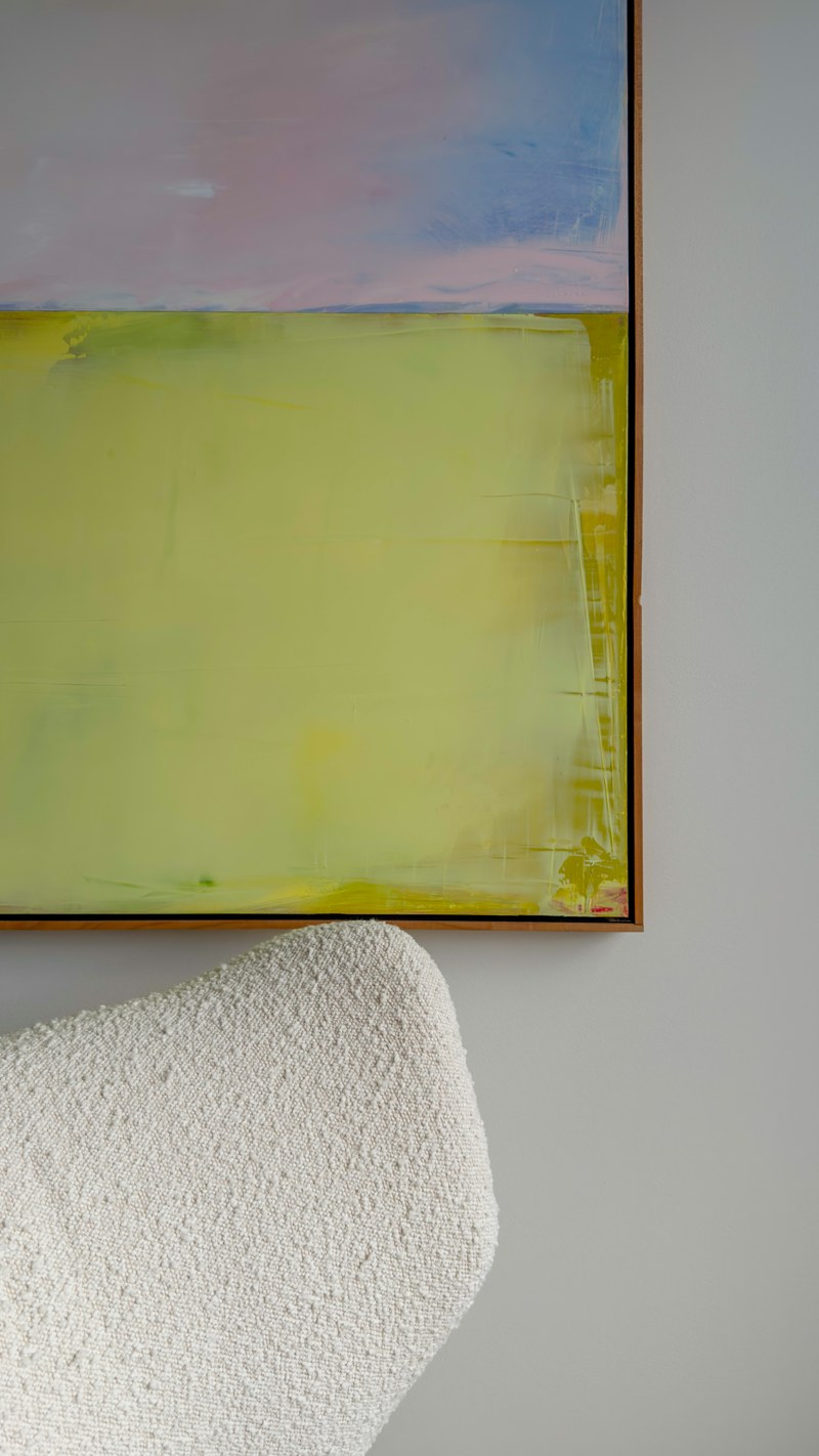 Bouclé upholstery and an abstract painting