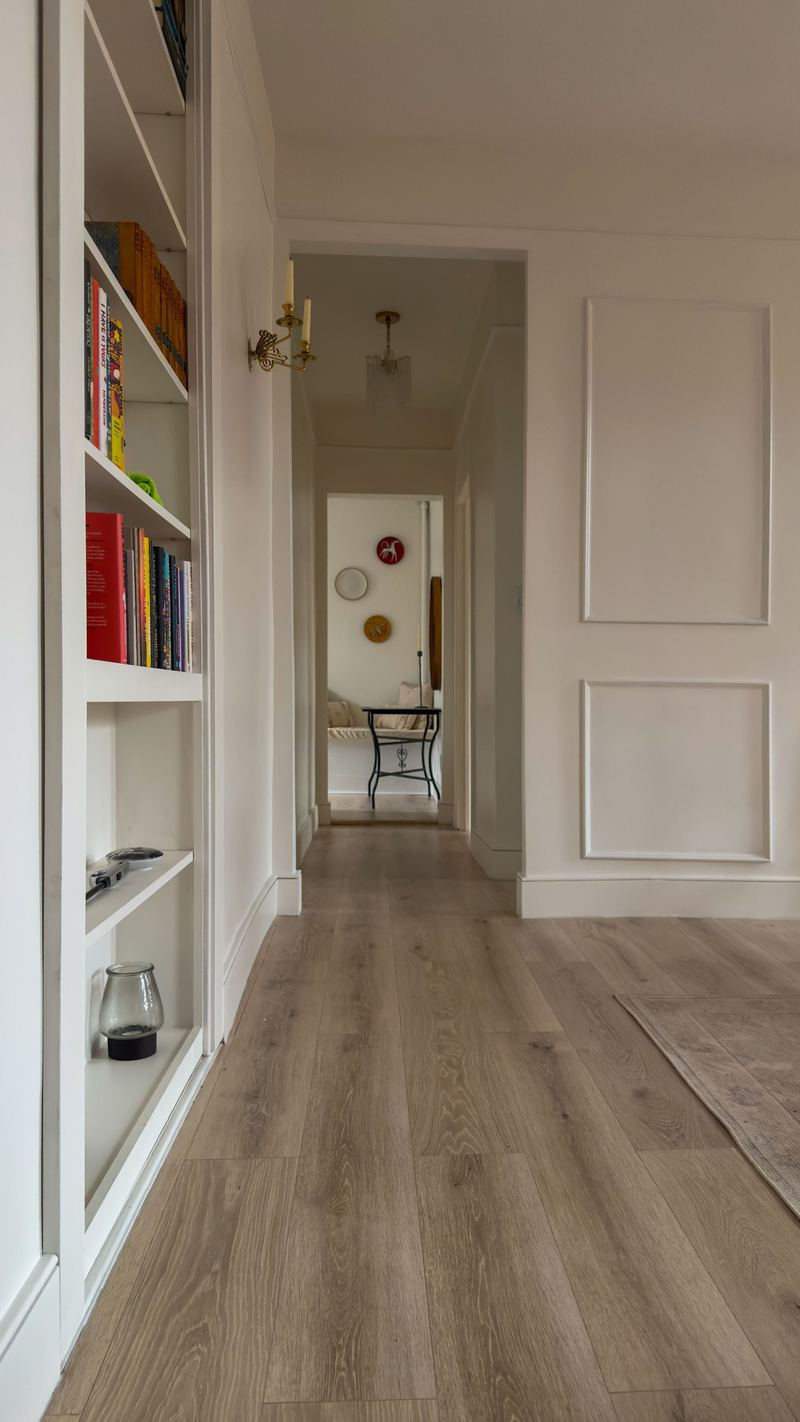 Hallway with built-in bookshelves